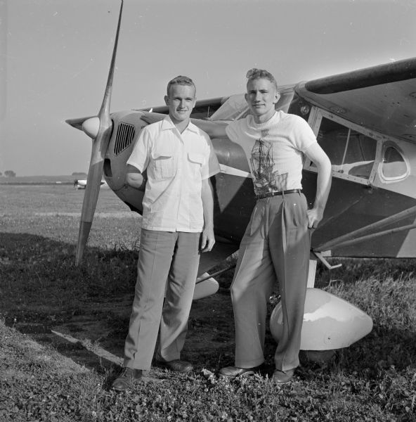 Brothers Franklin Myers, 19, University of Wisconsin student (left), and Russell Myers, 22, mechanic for the Madison Bus Company (right), bought their own plane and learned how to fly.