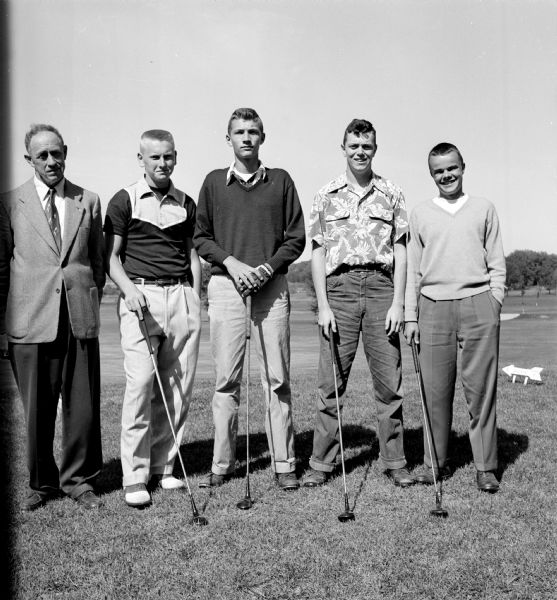 Group portrait of the West High School golf team, winners of Madison's 1953 high school golf tournament.  Left to right, Coach Clark Byam, Lowell Bakken, Craig Lawrenz, Tom Williams and Jack Allen.  Craig Lawrenz had the best score.