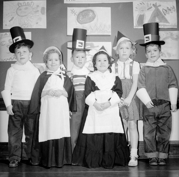 Children dressed as Puritans sing Thanksgiving songs for their fellow kindergartners at Franklin School.
