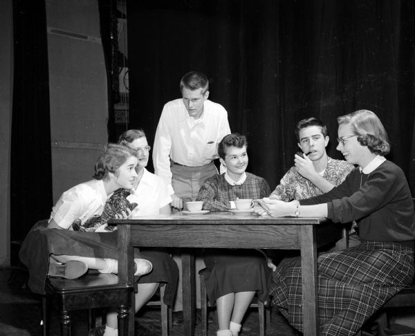 The play "I Remember Mama" will be presented Friday night in the West High School auditorium. At the rehearsal are, left to right: Bette Jo Wivel, Signe Briedis, Tom Dean, Eileen Harebo, Legrand Lillywhite, and Wally Allen.