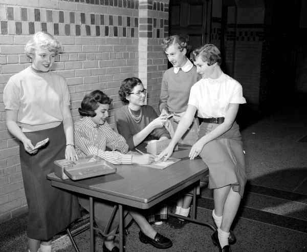 Students in charge of ticket sales for "Berkeley Square," East High School's fall play, are Betty Schneider, Betty Biddick, Carol Finch, Carol Kruse, and Jean Massey.