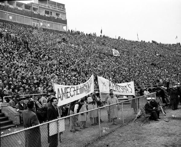 Fans of Alan Ameche from his home town of Kenosha hold banners at the last home game for the University of Wisconsin star at Camp Randall stadium.