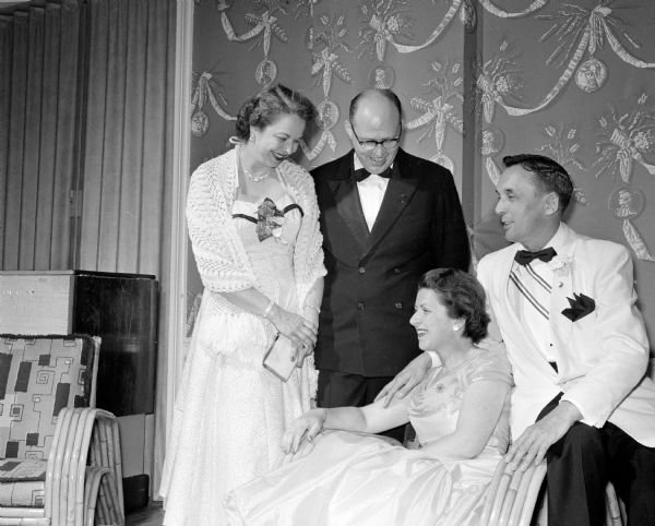 Among the formally attired guests at the party at the Maple Bluff Country Club are Alice McGuire, Howard Buenzli, Margarate Buenzli, and Wilbur McGuire. Guests attended from a 14 county area.