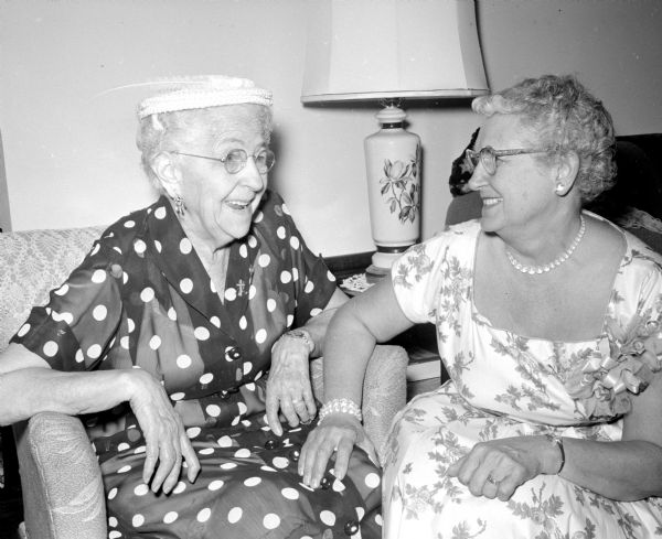 Della Larson and Gladys Wundrow chatting during a summer tea put on by the Madison Shrine No. 6 White Shrine of Jerusalem, held at the home of Forrest and Loretta Iler on Winnequah Road.
