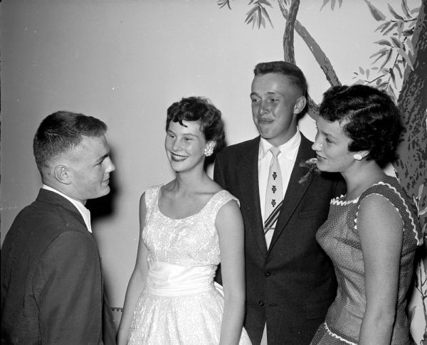 Two couples attend a Maple Bluff Country Club dance for teenagers with the theme of "Plantation Boogie."