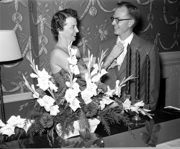 Shown at a dinner-dance given by members of the Dane County Dental Auxiliary held at the Maple Bluff Country Club, is the general chairman of the party, Shirley Simley, with her husband, Dr. Donald O. Simley.