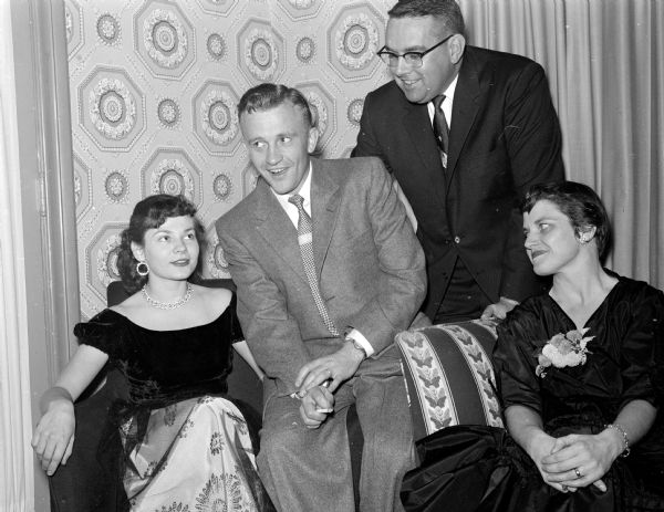 Betty Buchanan (left), treasurer of the auxiliary; her husband, Dr. Daro Buchanan; Dr. William Rundell and his wife, Ann Rundell, president of the auxiliary, are shown at a dinner-dance given by the auxiliary of the Dane County Dental Society.