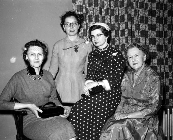 Mabel Boardman, Rita Sullivan, Lottie Fryer and Lucille Reid attend a banquet celebrating Phi Delta Gamma's 25th anniversary and Founder's Day. Rita and Lottie were initiated into the fraternity prior to the dinner.