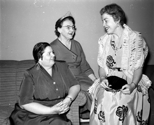 Margaret Cooper (left), Helen Weiss and Doris Pratt attend a banquet celebrating Phi Delta Gamma's 25th anniversary and Founder's Day.