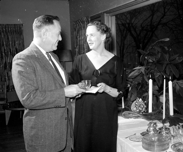Members of the Grace Episcopal Church Rector's Guild attend a tea dance held at the Blackhawk Country Club. The Bob Arden Orchestra provides the music. Shown (left to right) are: Robert Nickles, Jr., 1654 Sherman Avenue, and Mrs. Edward H. Rikkers, 825 Farwell Drive, general chairman of the tea.
