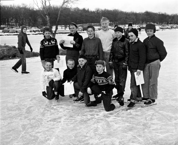 Group portrait of the winners in the boys division of the speed skating championship races at Vilas Park. Front row, left to right: Mike Bailey, Jim Sperling, Eugene Tremilling and Billy Forrest. Back row: Don Risley, Richard Schappe, Bill Zeier, Tom Kroncke, Richard O'Leary, Pat Elliott and Terry Chase.