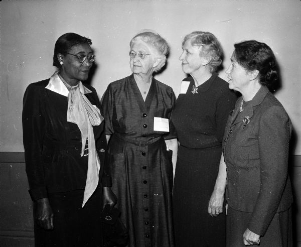 Among those attending a meeting at Neighborhood House, 768 West Washington Avenue, are left to right, Mrs. Ola Jordan, Jennie Schrage, Marguerite Judd and Mary Lee Griggs. The gathering was for neighborhood residents, board members of the Neighborhood House Association Auxiliary and Madison Neighborhood Centers and others interested in community problems.