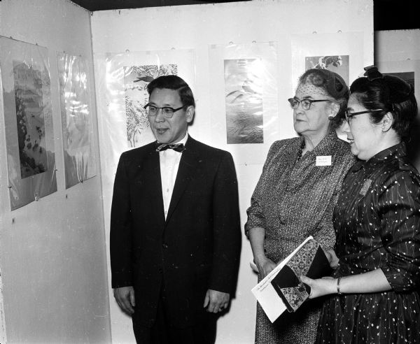 Iwao Hara (left), Margaret Schorger, and Mae Hara attend the opening of an exhibit of Japanese prints at the U.W. Memorial Library.