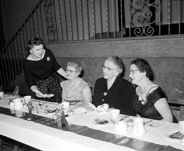 Shown at the speakers table at the Shrine banquet are, left to right, Mrs. Cromer Chapman with her mother, Gladys Wundrow; Caroline Schwingel with her daughter Lucille Fosmark.