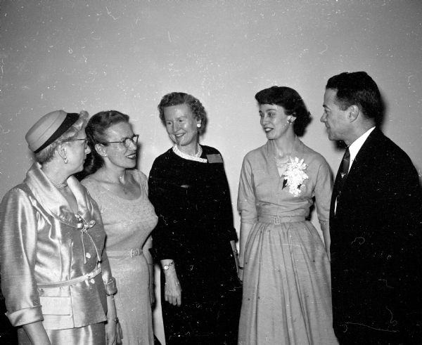 Ethel Trenary (left), Eloise Keller, Caroline Thompson, Mrs. Graham Hovey, and Prof. Graham Hovey, speaker at the event, chat at the annual joint meeting of the Zonta, Soroptimist, and Altrusa clubs.