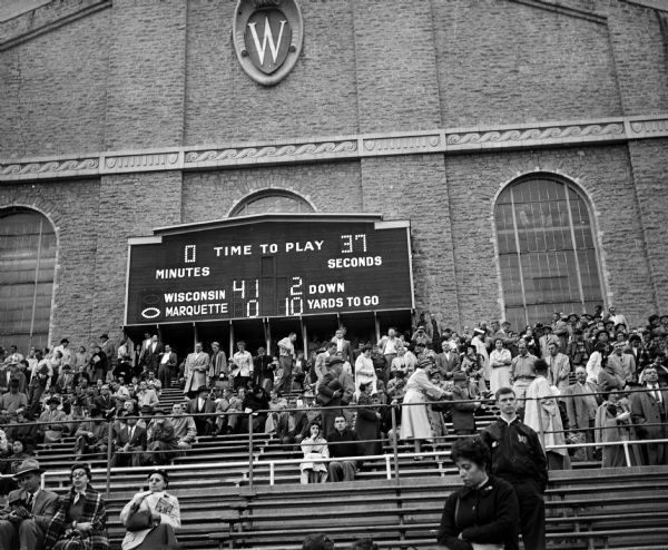The scoreboard at Camp Randall showing the final score of the football game between Wisconsin and Marquette. It was Milt Bruhn's first game as Wisconsin's head coach.