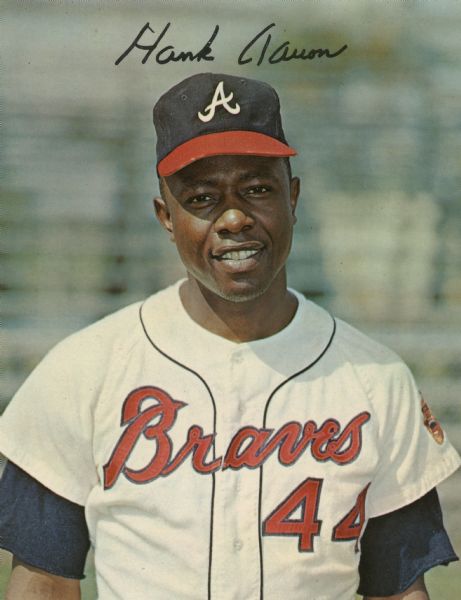 Waist-up portrait of Hank Aaron in his Atlanta Braves uniform. The print is autographed at the top.