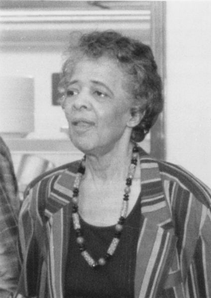 Vel Phillips, wearing a striped jacket and necklace.