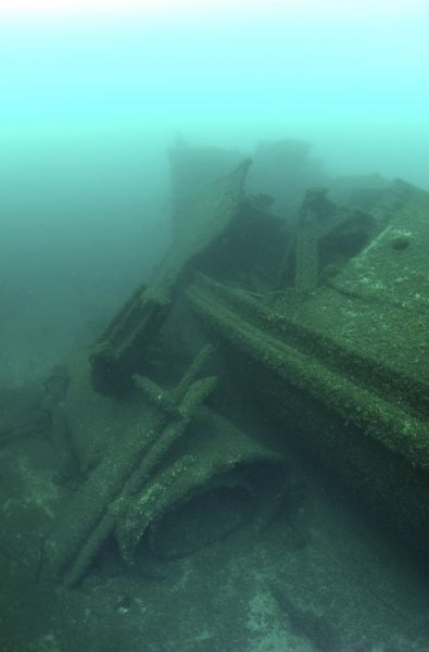 Underwater view of a smokestack of the <i>Milwaukee</i>. While the ship is sitting upright, the smokestack is resting on the bottom of the lake bed.
