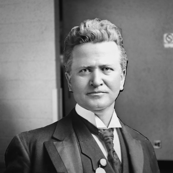 A head and shoulders portrait of a life-size figure of Robert La Follette mounted on a board, also known as "Fighting Bob." The figure is standing in the coliseum at the Alliant Energy Center.