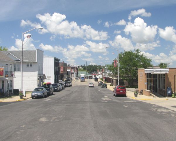 View down the center of the street of downtown business district.