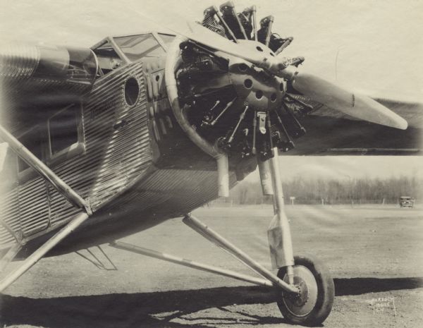 Three-quarter view from front left of the front of a Hamilton Metalplane H-21 sitting on a runway. The airplane was equipped with a 400 hp Pratt & Whitney engine.