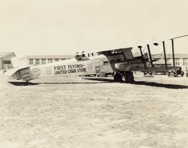 Right side view of a Sikorsky S-29-A sitting on a runway. The airplane was powered by two 400 hp Liberty L-12 engines. The tail identifier reads: "2756." Painted on the side is: "Cigars United," "First Flying United Cigar Store," "Largest in the World Because We Serve the People Best."

The airplane was sold to Roscoe Turner in 1926, who used it to advertise for various companies. Here, the S-29-A is being used as part of an advertising campaign for United Cigars where it served as a "Flying Cigar Store" stocked with tobacco products and other small items such as gum, watches, and playing cards. The airplane flew across the U.S. selling these products in various towns and cities. It was bought and reworked by Howard Hughes in 1928 for his film "Hell's Angels" in which it was used as a German Gotha bomber.