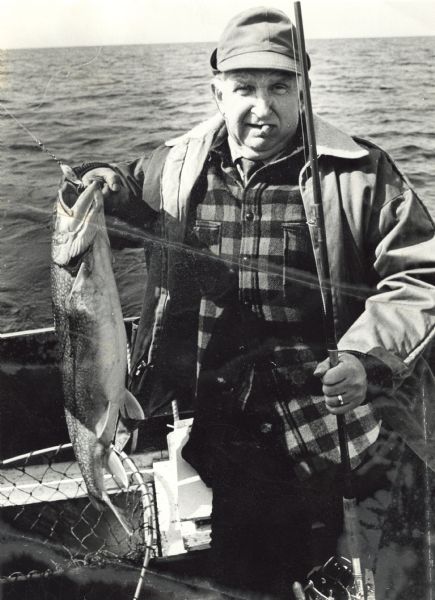 Sid Boyum holds a catch while out on Lake Michigan aboard a chartered fishing boat with Bay Charter Service out of Sturgeon Bay. 