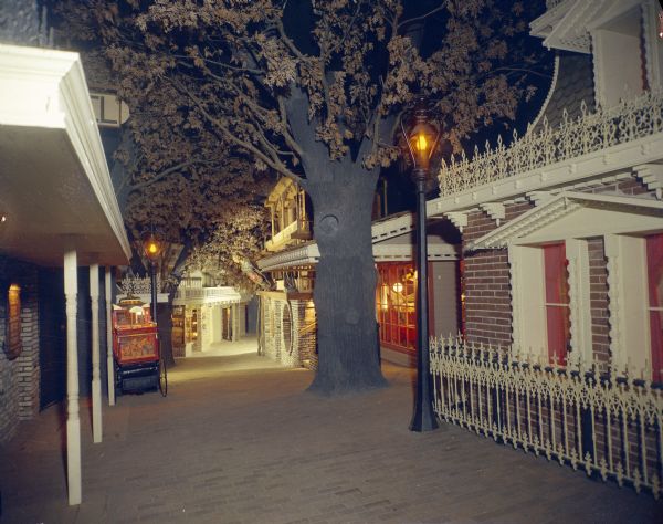 The Streets of Yesterday, a nostalgic faux downtown, on exhibit at House on the Rock. This photograph was used in the original brochure for House on the Rock. Sid Boyum served as the Artistic Director for the attraction, helping develop promotional brochures. 