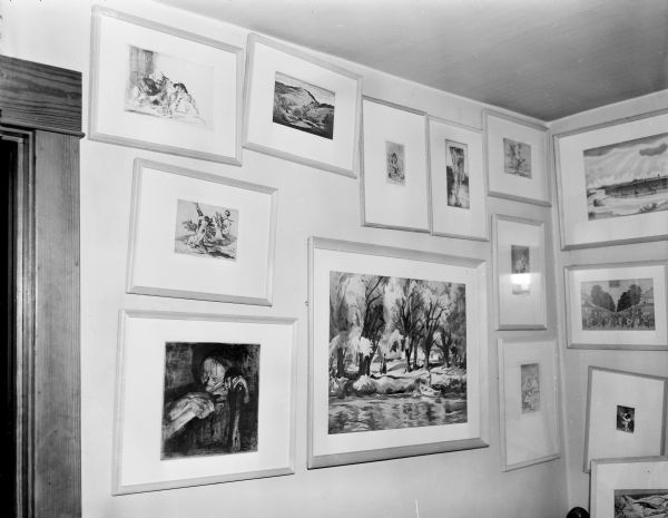 In a corner of the upstairs bedroom (Sid's house) there are a number of painting works with different sizes and themes hanging on the wall. 