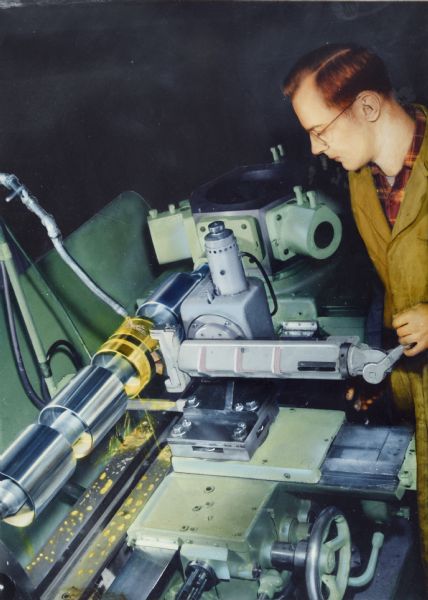 Color illustration art of a man operating a lathe at Gisholt Machine Company. A photograph has been heavily airbrushed with color. 