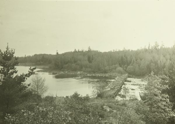 An elevated view of the bridge and dam on the Old Dawson Trail at the end of Sturgeon Lake. The dam was built in 1873 by Simon Dawson.