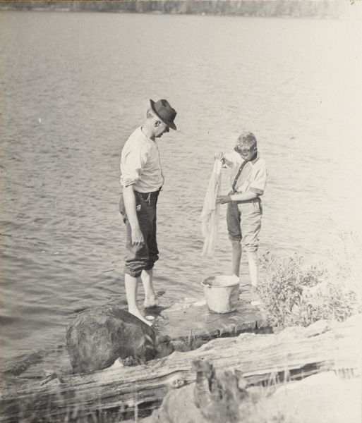 Howard and Jack Greene doing laundry in Lake McFarland.