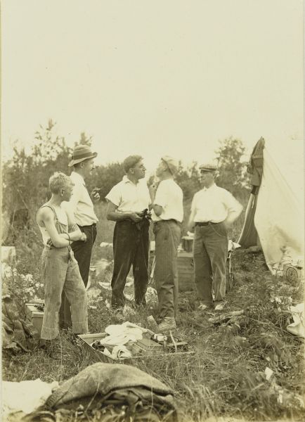 The Gang at their campsite. From left to right are: Charles (Carl) Greene, Bill Marr, Dr. (Doc) Copeland, an unidentified man, and William MacLaren (Billy Mac). Doc and the unidentified man appear to be facing off in a playful manner.