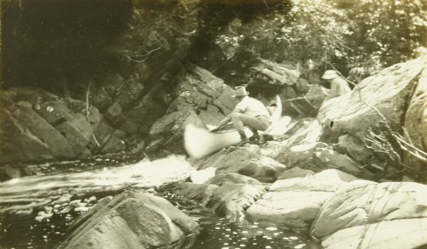 The Gang guiding their canoes through rocks and cascades on the Presque Isle River.