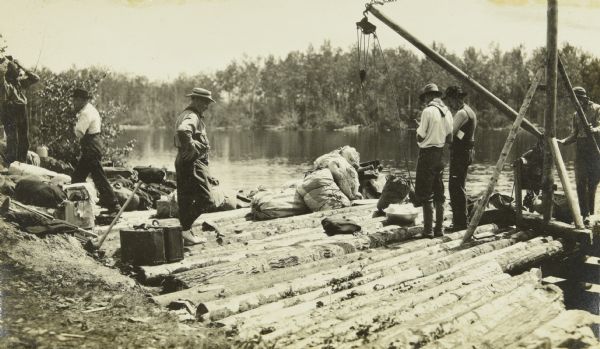 The Gang standing on Fisherman's Dock on Fall Lake with their travel supplies at the beginning of their trip. Billy Mac is second from the left, and third from the left is Clay Judson.