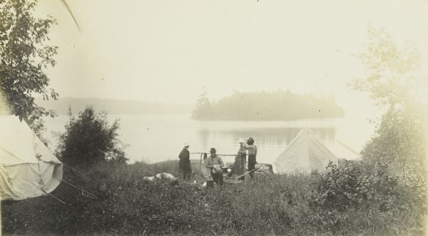 The Gang at their camp near Crane Lake. Fog is hanging over the lake.