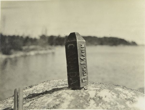 The international boundary marker between the United States and Canada. This is on the Canadian side of Sand Point Lake in the Narrows between Sand Point and Namakan Lakes.