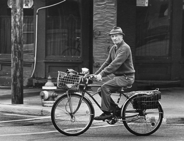 A resident of Spring Green riding his bike downtown.
