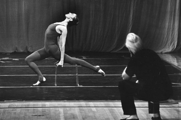 Alwin Nikolais watches as Jessica Sayre rehearses a new dance. The Nikolais Dance Company later performed at the Union Theater. Nikolais was awarded a Mayoral Citation for Alwin Nikolais Dance Week in December 3-10, 1978.