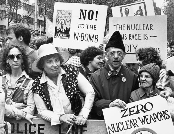 A crowd of protesters gathered with picket signs to speak out against nuclear energy and weapons development in the U.S. Bella Abzug, is front left.