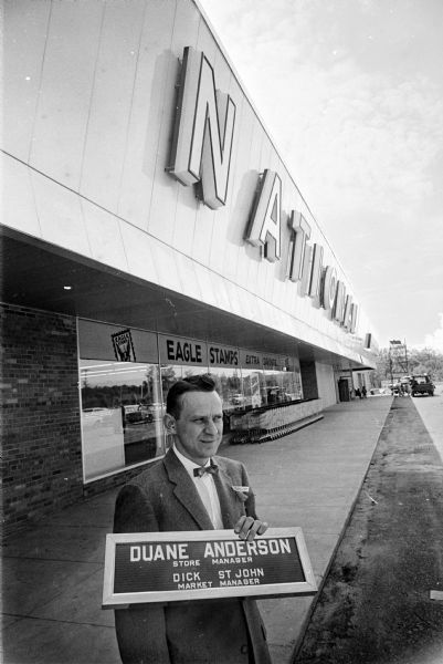 Duane Anderson standing in front of his National Food Store which opened on May 23, 1961. It was located in the North Gate Shopping Center at 1135 North Sherman Avenue.