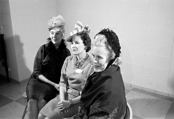 The Women's Societies of Christian Service of the Methodist Churches of Madison observed the Society's 20th anniversary with a "Heritage Tea."  Among the models on the program "Milady's Hats Thru the Years" are, left to right, Marion Staidl, Lola Yde, and Florence Roderick.