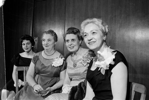 Group portrait of the speakers for the Matrix banquet which honors outstanding Madison women. From left are: Pat McCarthy, Rockford, Illinois, president of the Associated Women Students, student response; Beatrice Lampert, town response; S. Janice Kee, toastmistress; and Mrs. Ivy Baker Priest, Arlington, Virginia, former treasurer of the United States, main speaker.