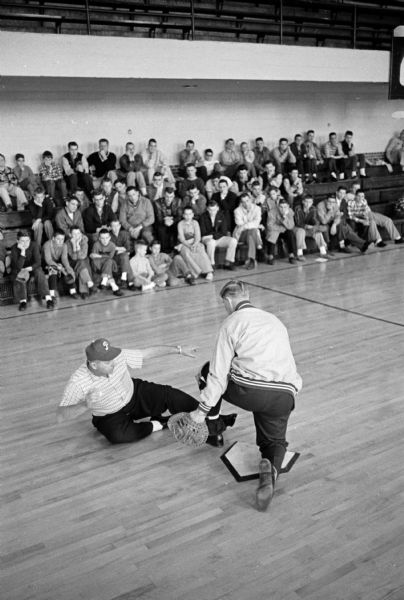 Phils' Scouts Bill Freese (right) and Eddie Dancisak demonstrating techniques at an Edgewood High School baseball clinic.