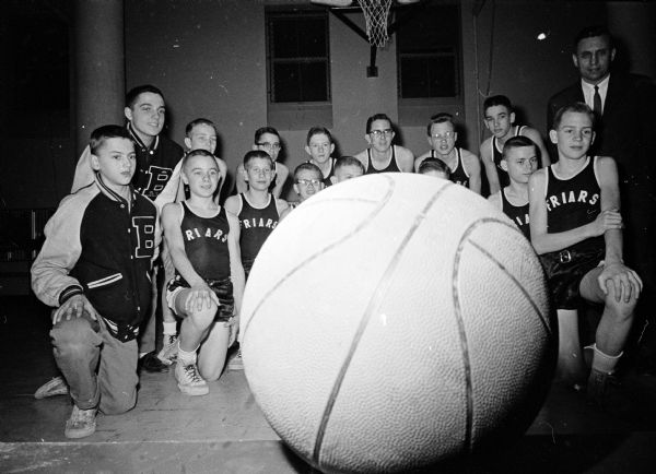 The Blessed Sacrament School Friars won the Parochial Grade School League basketball championship with a record of ten victories and no defeats.