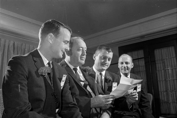 Looking over the program for the ninth annual Management Night at the Loraine Hotel are, left to right, Reed Coleman of Madison Kipp Corporation, I.W. Lackore of the Madison Chamber of Commerce, Richard A. Johnson of Gisholt Machine Company, and Allan C. Mayer of Oscar Mayer and Company.