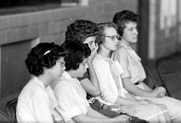 The last five spellers left in the Iowa county championship spelling bee all look a bit worried as they wait for the final rounds of the bee, held in the Dodgeville High School. They are, left to right, Jean Ann Halverson, Dodgeville; Irene Hegland, Hollandale; Sandra Larson, Dodgeville; Marlene Knutson, Highland; and Julie Matthews, Platteville.