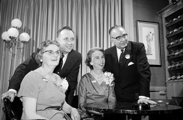 Members of the Madison chapter of the American Business Women's Association are shown with their bosses at the annual ABWA Boss Night banquet. Left to right: Marguerite Townley and Dr. John Porter of the VA hospital; and Eleanor Eichman and John Shiels, president of the Madison Bank and Trust Co.
