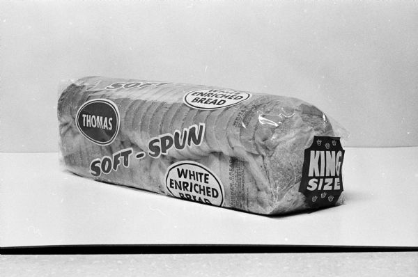 Studio shot of a king size loaf of Thomas soft-spun white enriched bread.